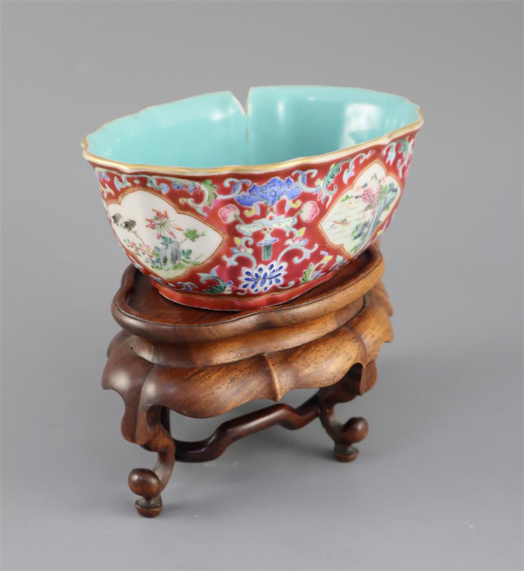 A Chinese ruby ground jardiniere, Daoguang mark and of the period (1821-50), 17cm wide, 6.5cm high, wood stand
